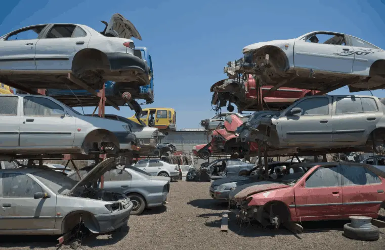 Sustainable vehicle recycling in Brampton showing processed scrap car bodies.